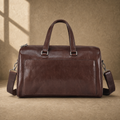 Coffee-brown executive travel duffel with removable shoulder strap, front view
