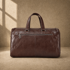 Coffee-brown executive travel duffel with rear zipper pocket and luggage sleeve