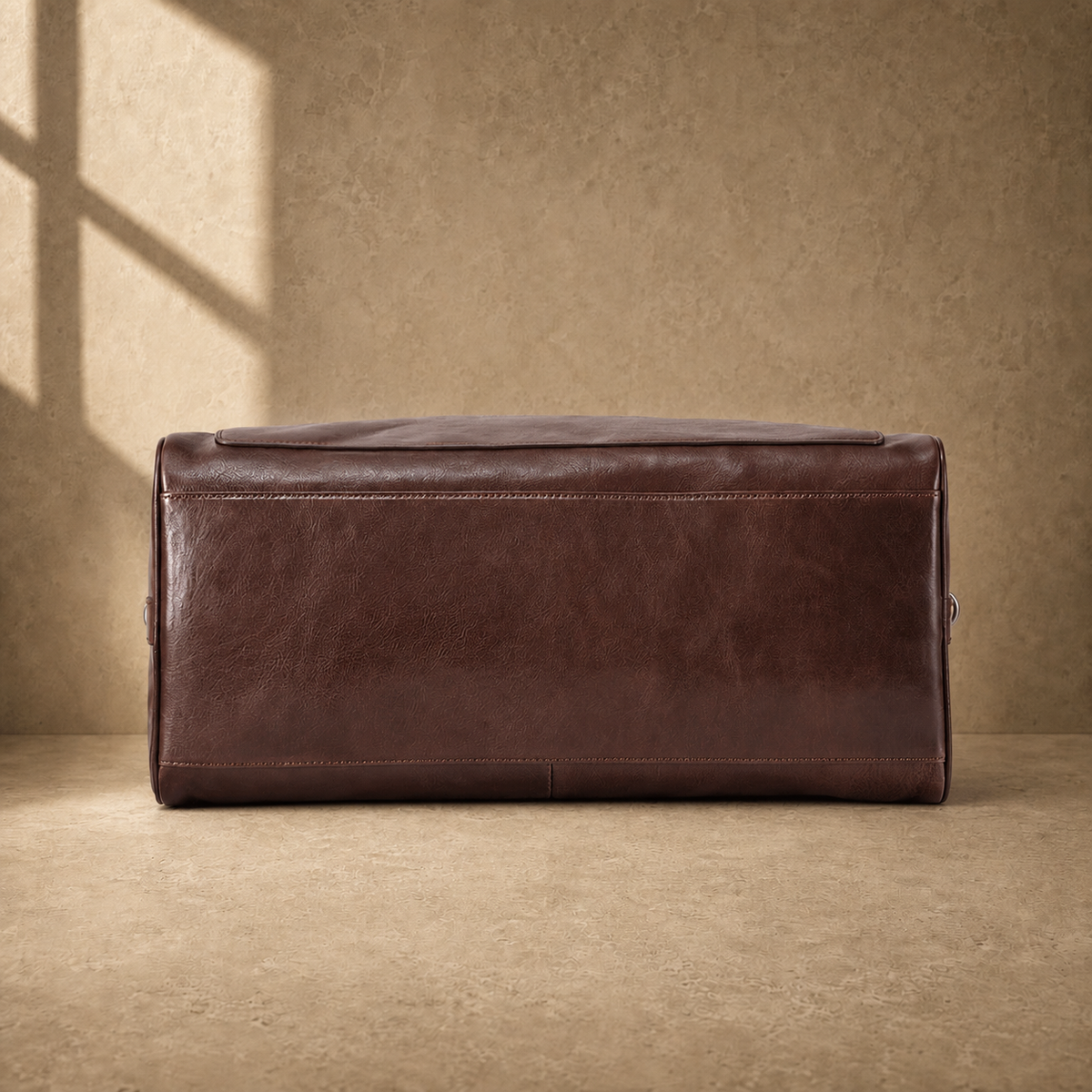 Coffee-brown executive travel duffel, reinforced base view