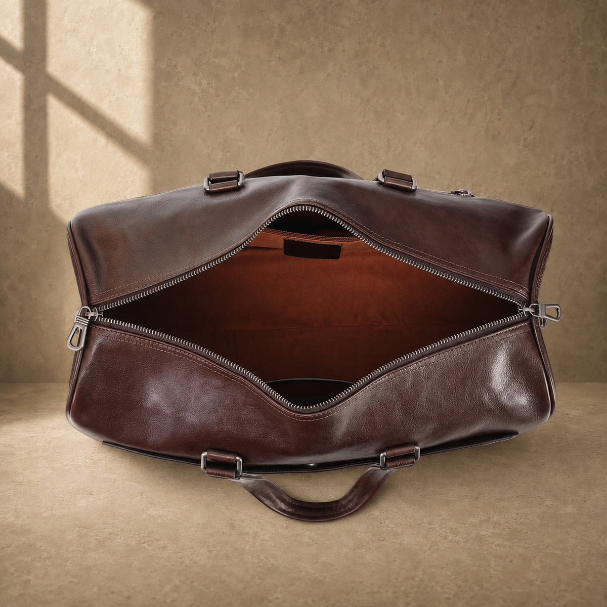 Coffee-brown executive travel duffel showing empty main compartment