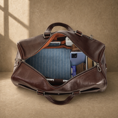 Coffee-brown executive travel duffel showing laptop and packed capacity
