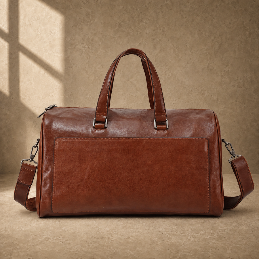 Dark-brown refined travel duffel with removable shoulder strap, front view