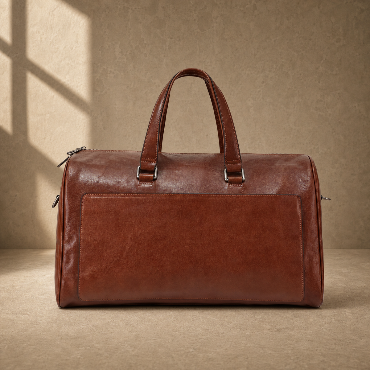 Dark-brown refined travel duffel without shoulder strap, front view