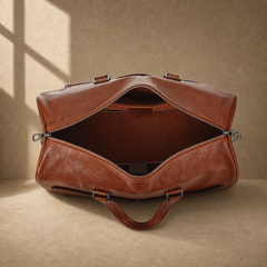 Dark-brown refined travel duffel showing empty main compartment
