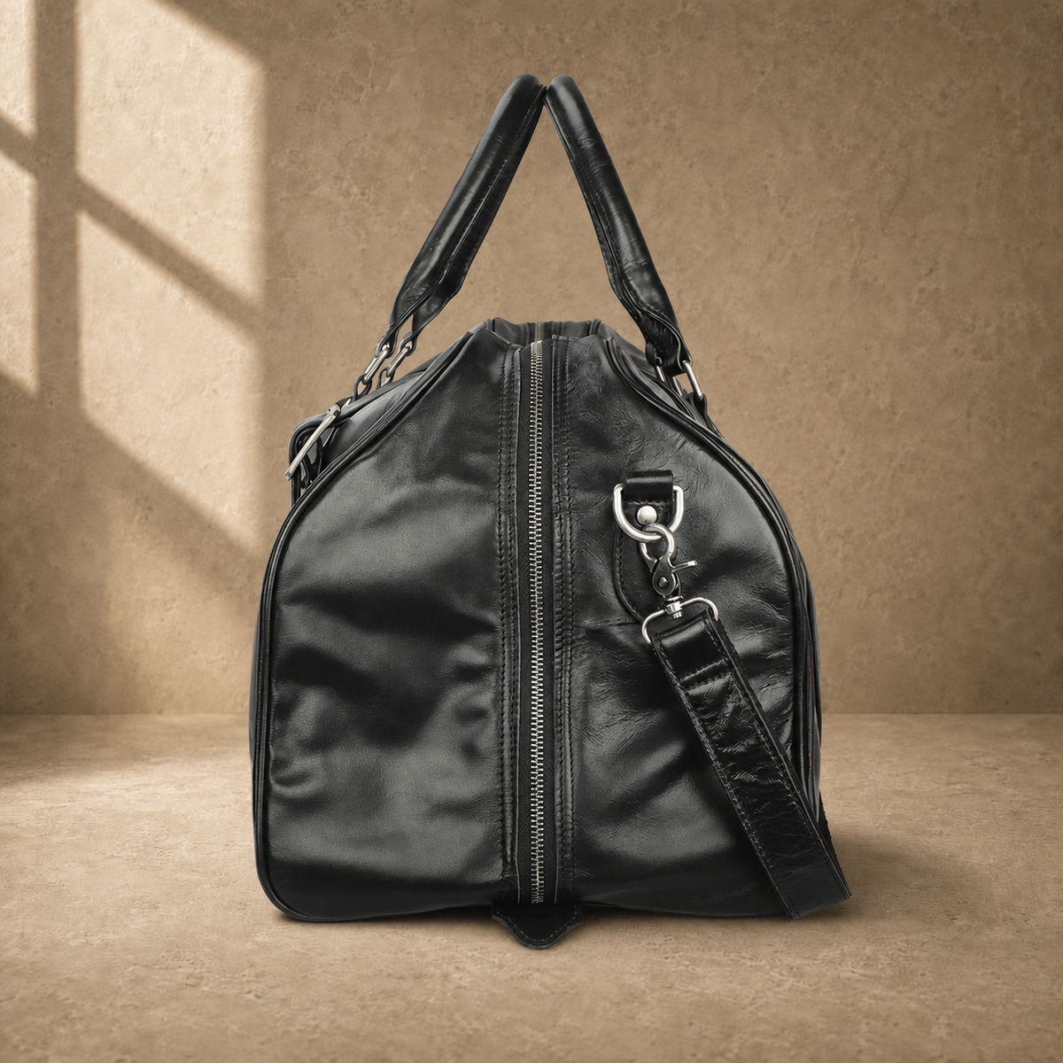 Black classic overnighter travel bag side view with strap hardware