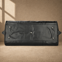 Black classic overnighter travel bag base with metal feet