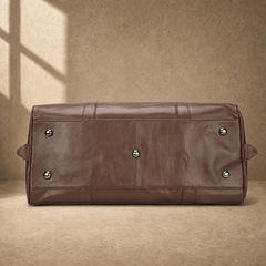 Brown classic overnighter travel bag base with metal feet