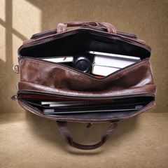 Brown leather multi-pocket briefcase packed 17-inch laptop capacity view