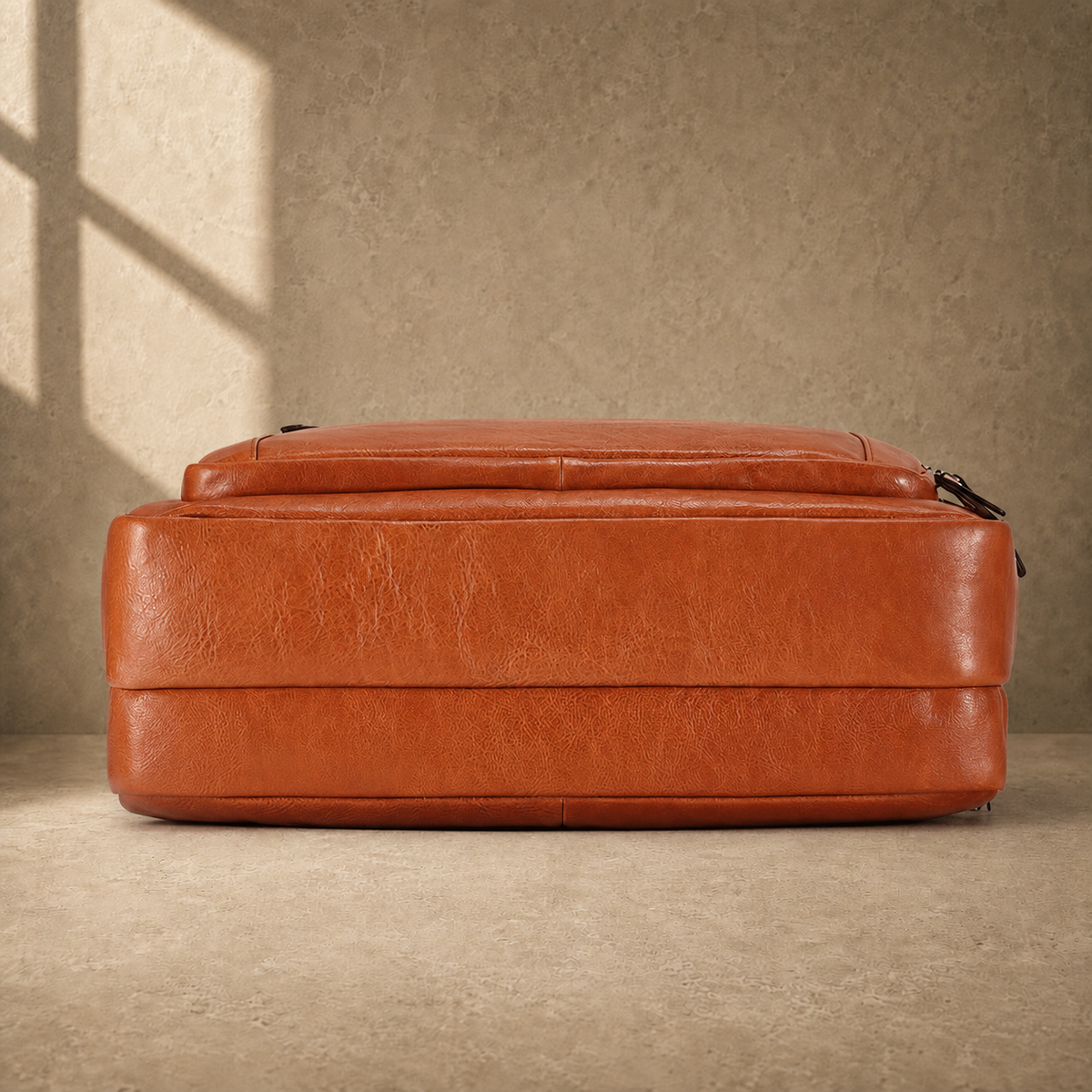 Light brown cowhide laptop briefcase reinforced base view