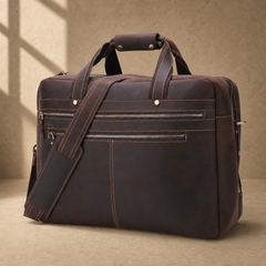 Dark brown cowhide 17-inch briefcase three-quarter view with shoulder strap