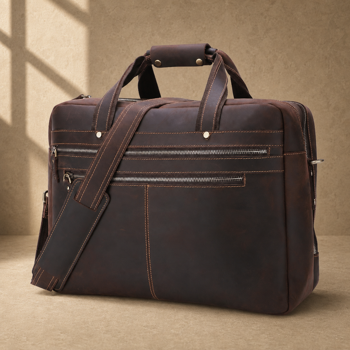 Dark brown cowhide 17-inch briefcase three-quarter view with shoulder strap