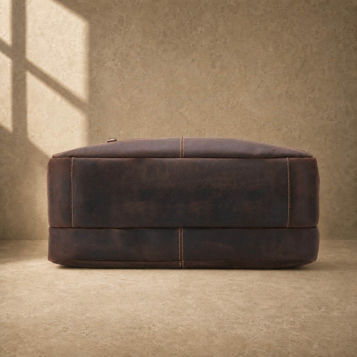 Dark brown cowhide 17-inch briefcase reinforced base view