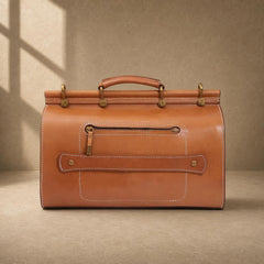 Cognac cowhide structured travel bag with rear zipper pocket