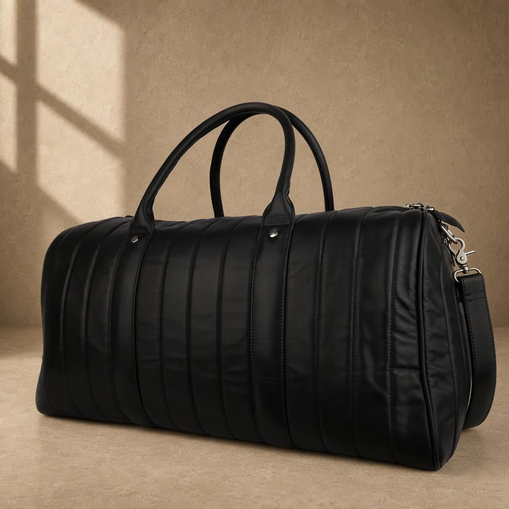 Black quilted cowhide travel duffel, three-quarter view