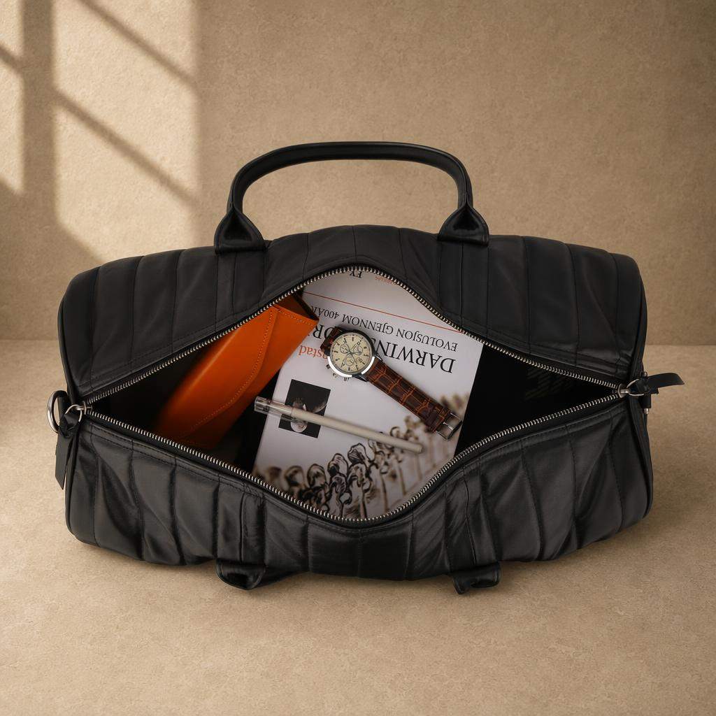 Black quilted cowhide travel duffel showing organized capacity