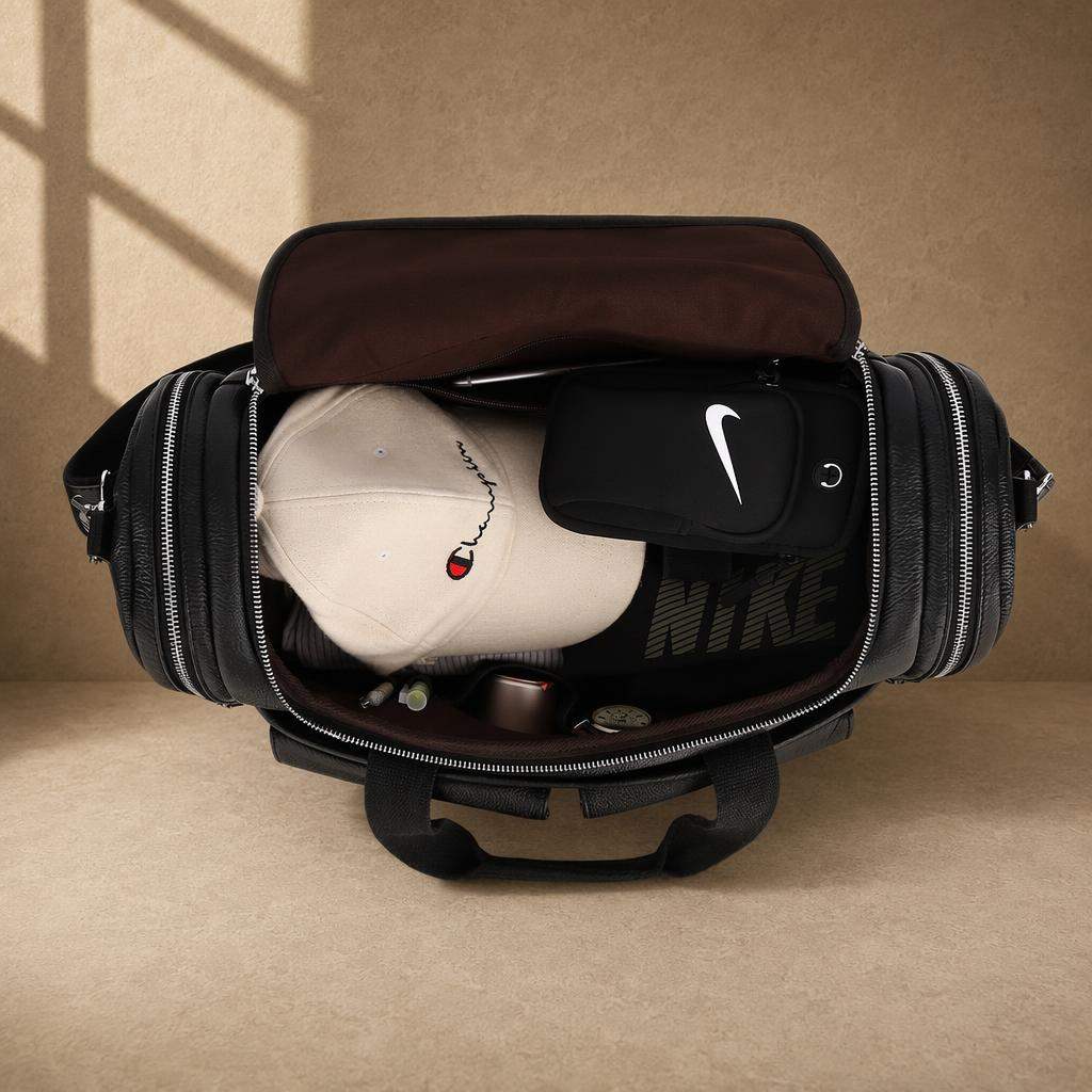Black pebbled cowhide utility duffel showing packed capacity