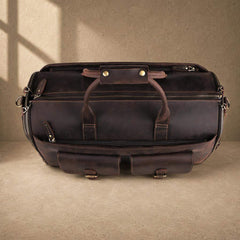 Coffee cowhide garment travel duffel, top view with exterior pockets