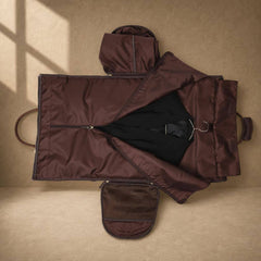 Coffee cowhide garment travel duffel with suit stored in garment section