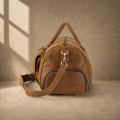 Brown leather shoe pocket travel bag, left end view