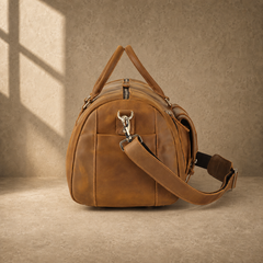 Brown leather shoe pocket travel bag, right end view