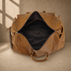 Brown leather shoe pocket travel bag showing the open lined interior
