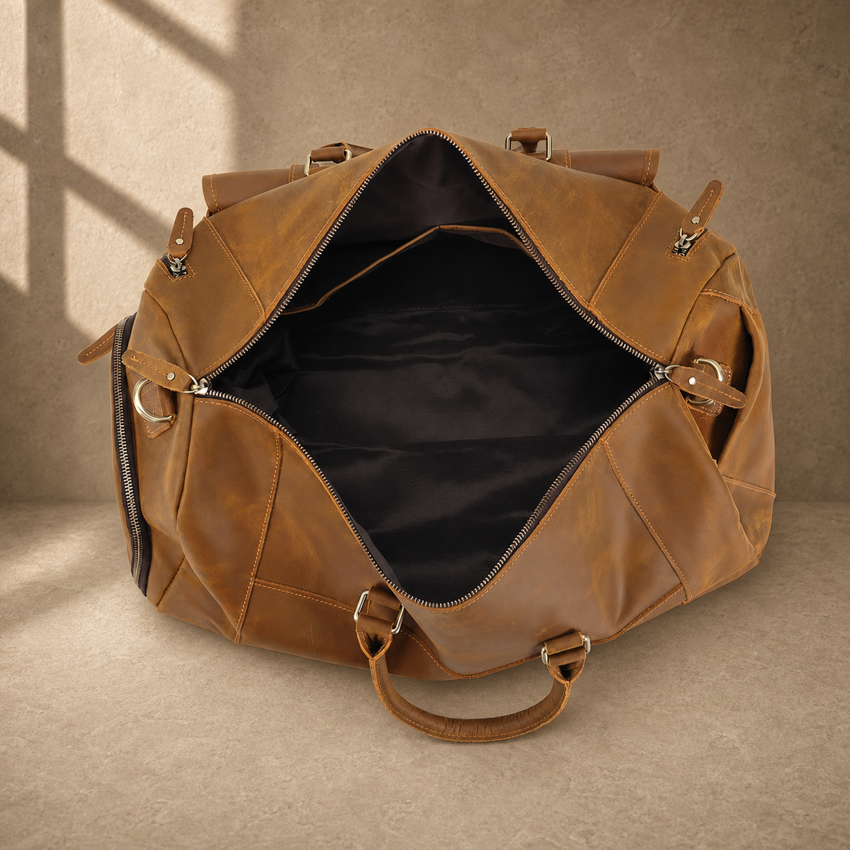 Brown leather shoe pocket travel bag showing the open lined interior