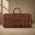 Dark brown shoe pocket travel duffel with shoulder strap, front view