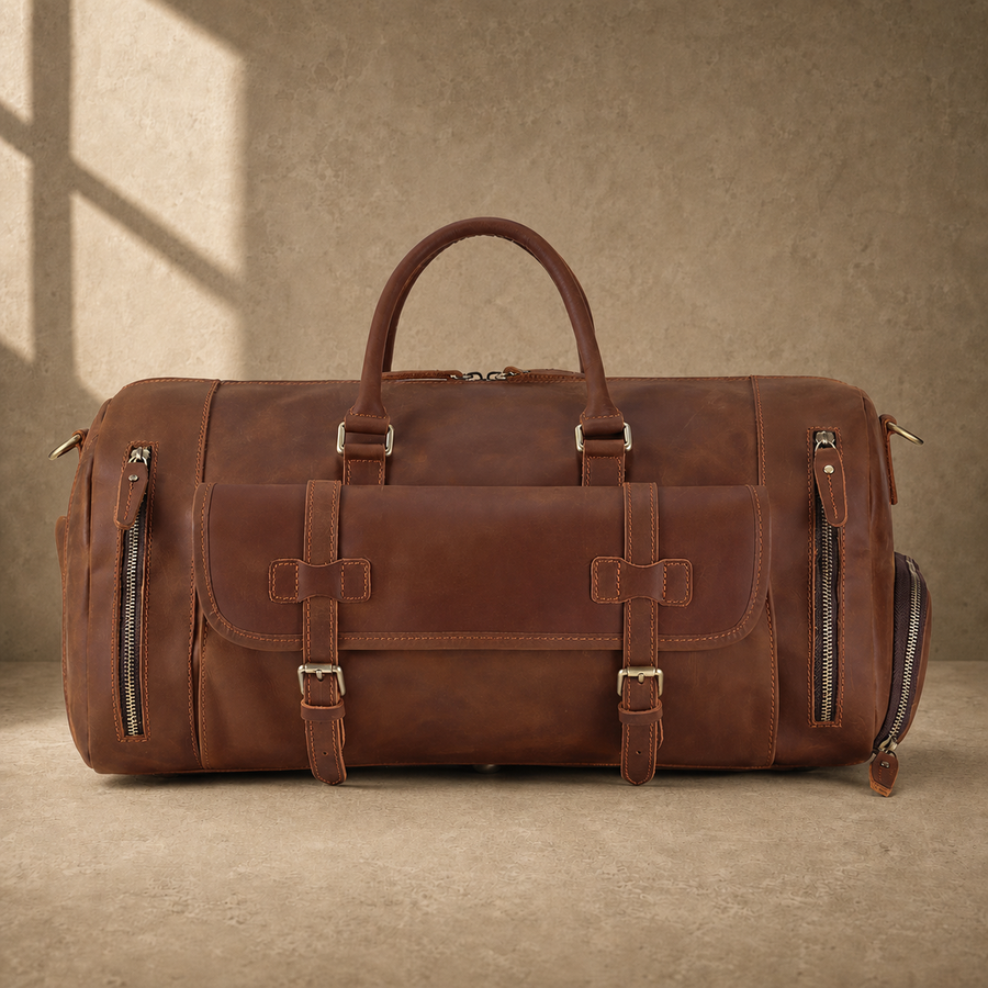 Dark brown shoe pocket travel duffel with shoulder strap, front view