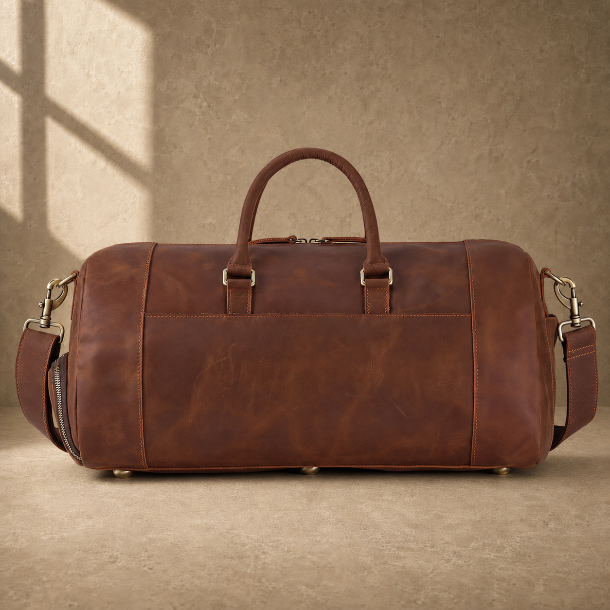 Dark brown shoe pocket travel duffel, rear view