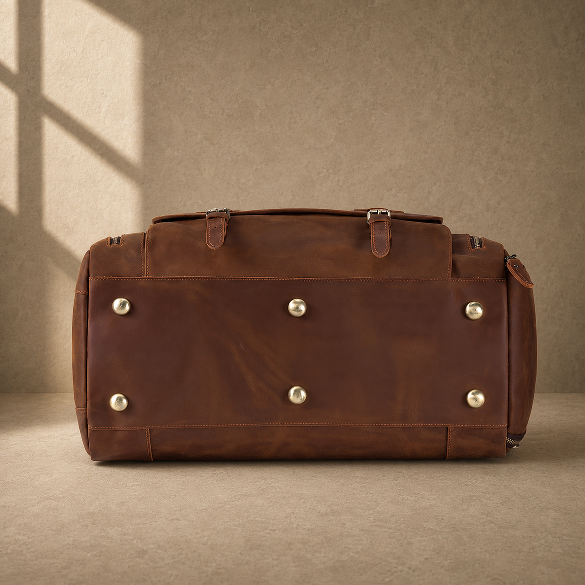 Dark brown shoe pocket travel duffel with protective base feet