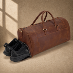 Dark brown travel duffel showing separate shoe compartment