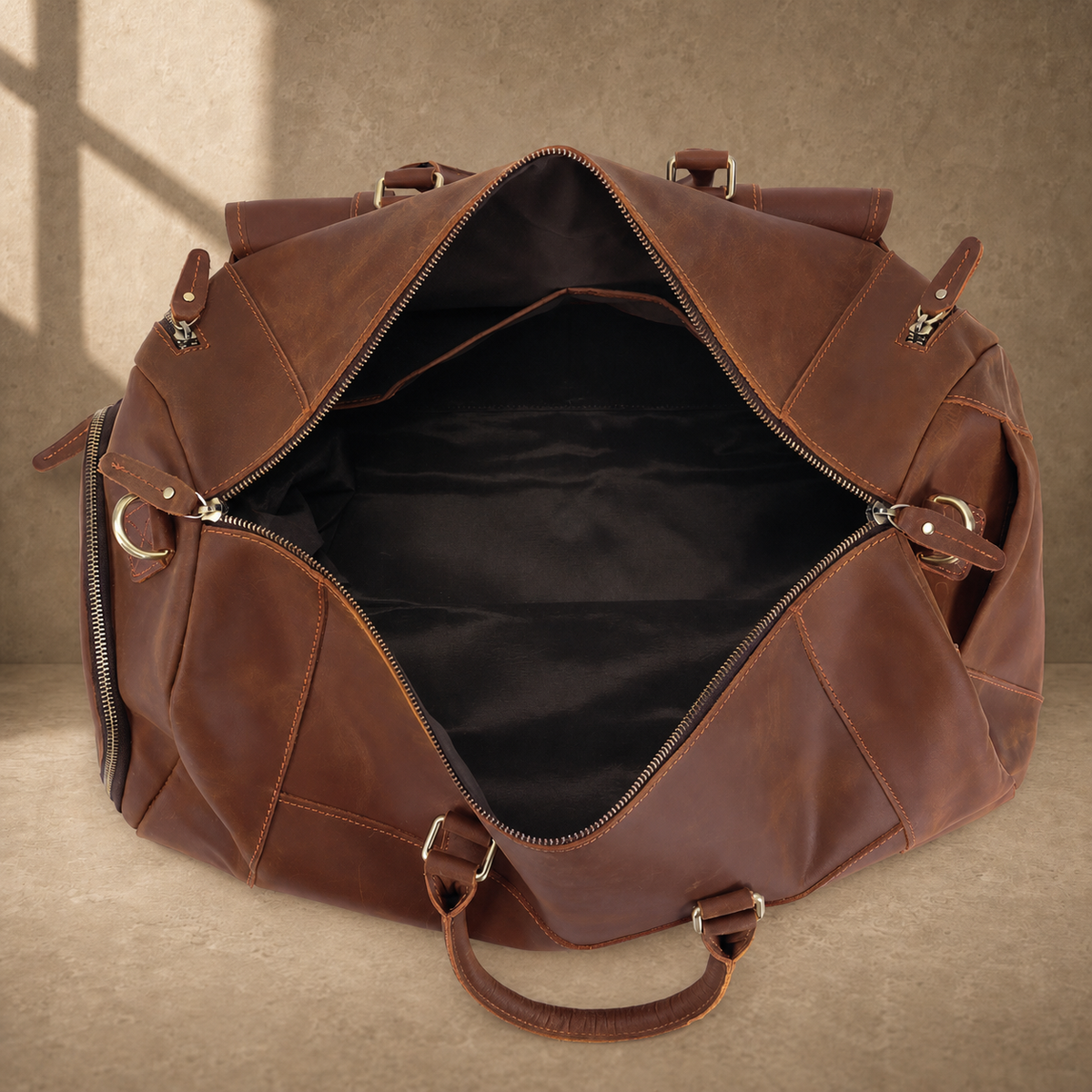 Dark brown shoe pocket travel duffel showing open main compartment