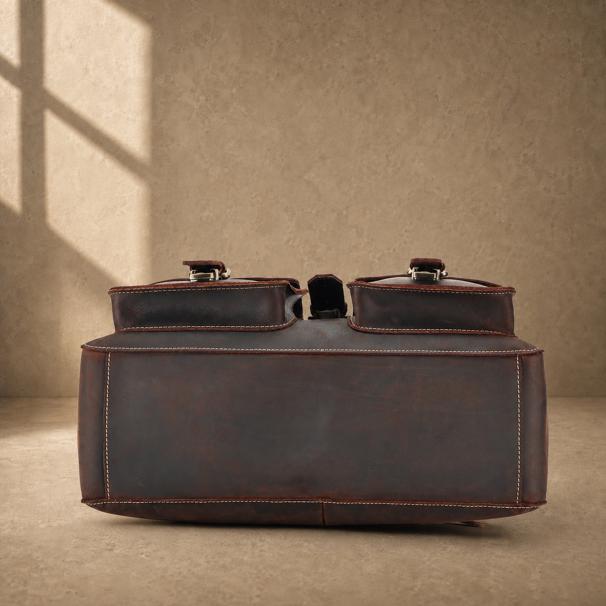 Coffee leather twin pocket briefcase reinforced base view