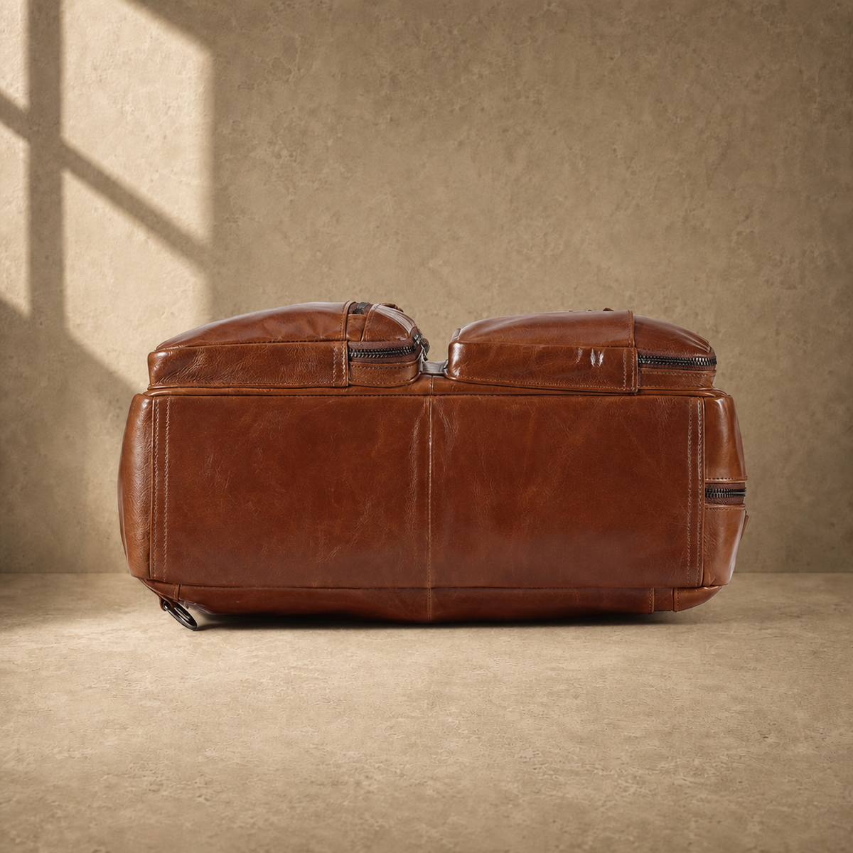 Brown leather convertible laptop bag, reinforced base view