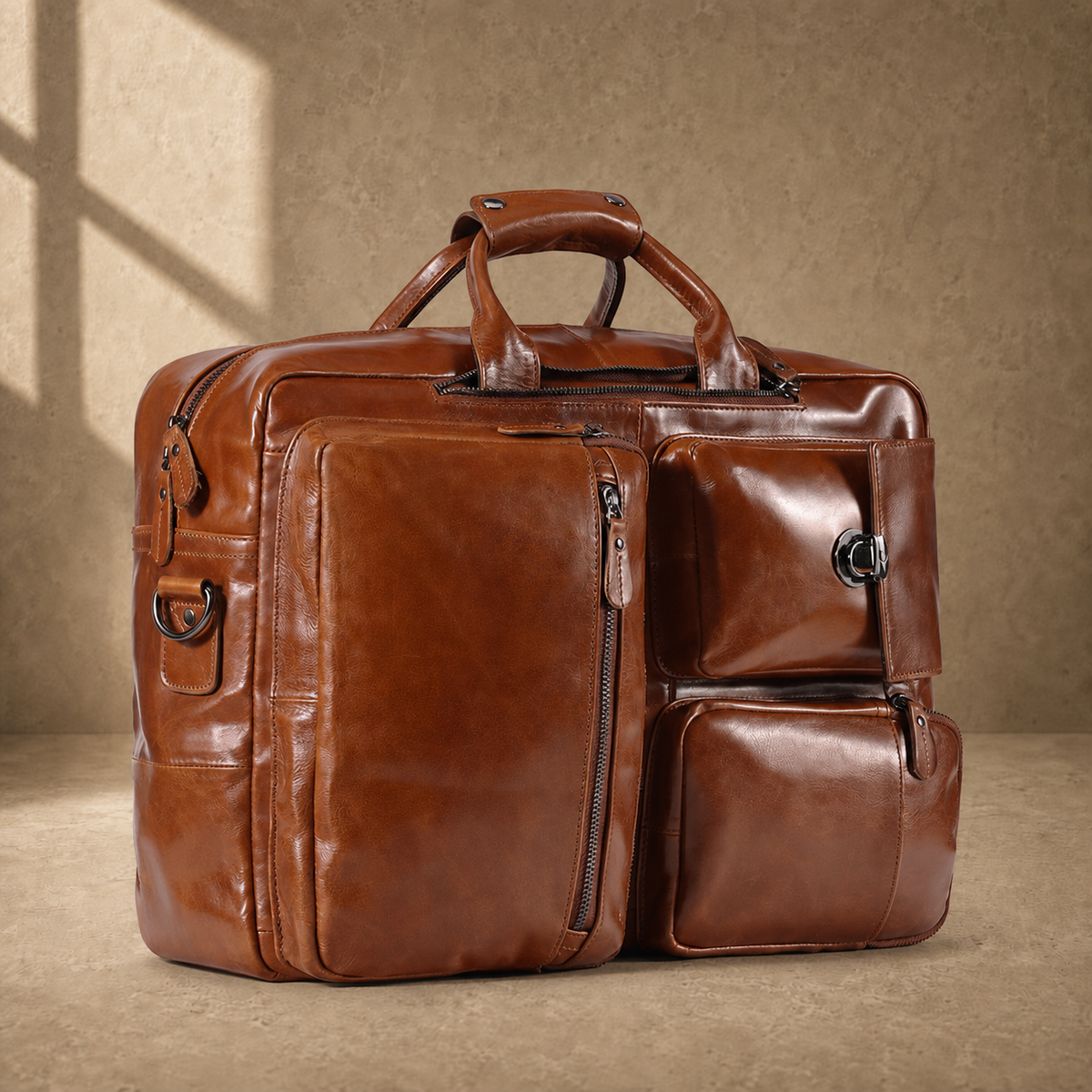 Brown leather convertible laptop bag, angled front view