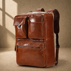 Brown leather convertible laptop bag in backpack mode, angled view