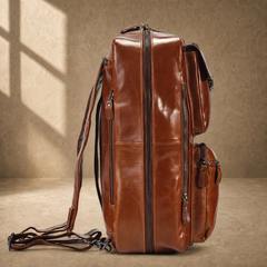 Brown leather convertible laptop bag in backpack mode, side profile