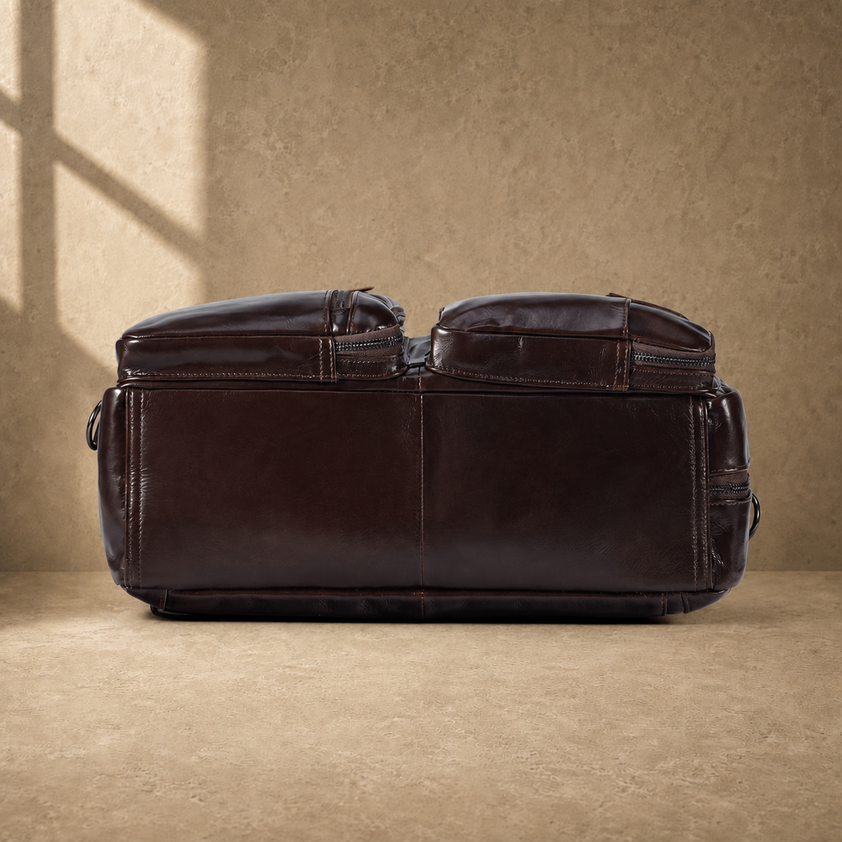 Coffee leather convertible briefcase reinforced base view