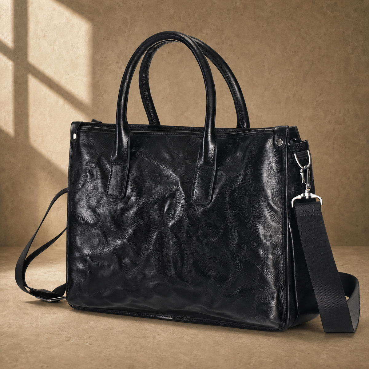 Black vegetable-tanned leather work briefcase three-quarter view
