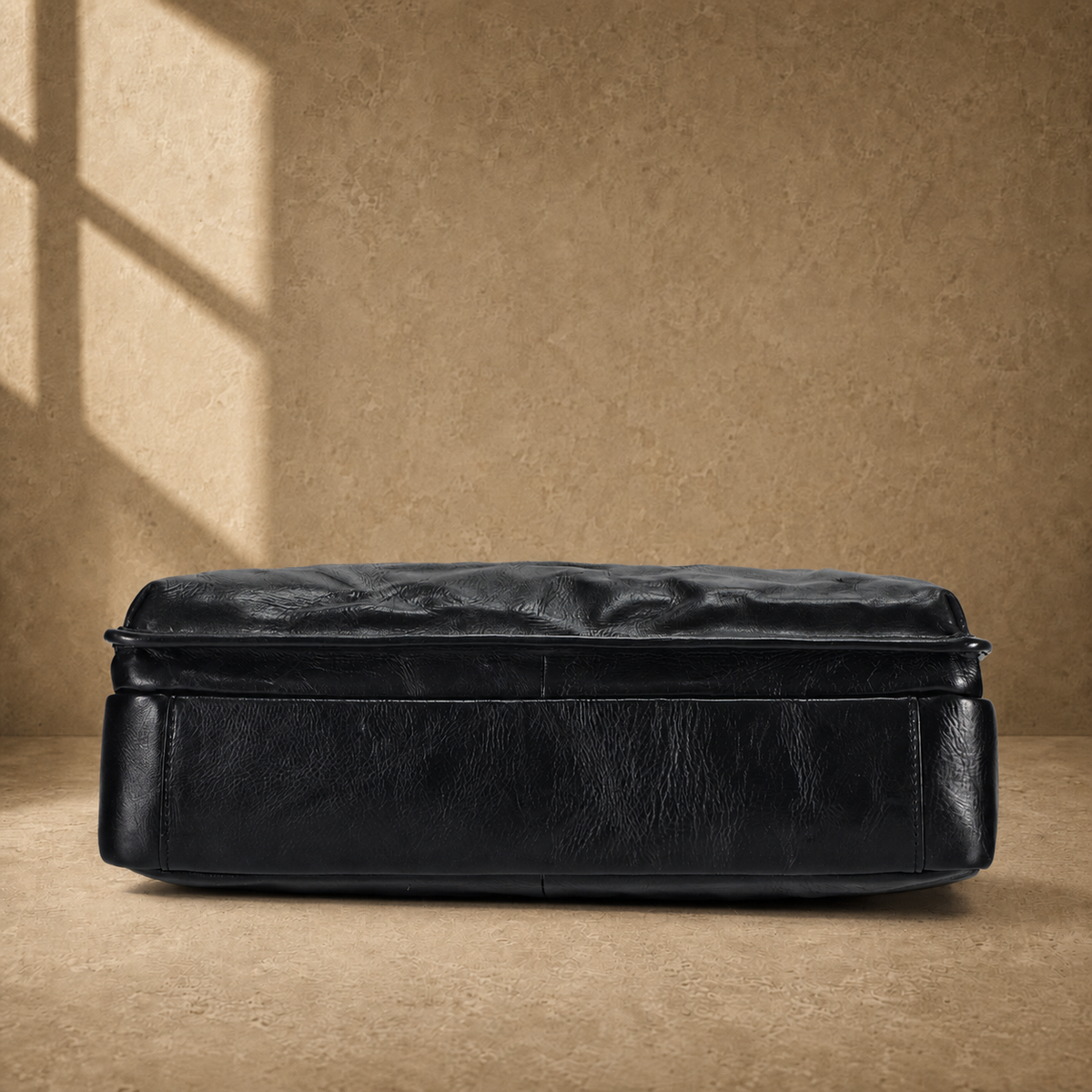 Black vegetable-tanned leather work briefcase reinforced base view