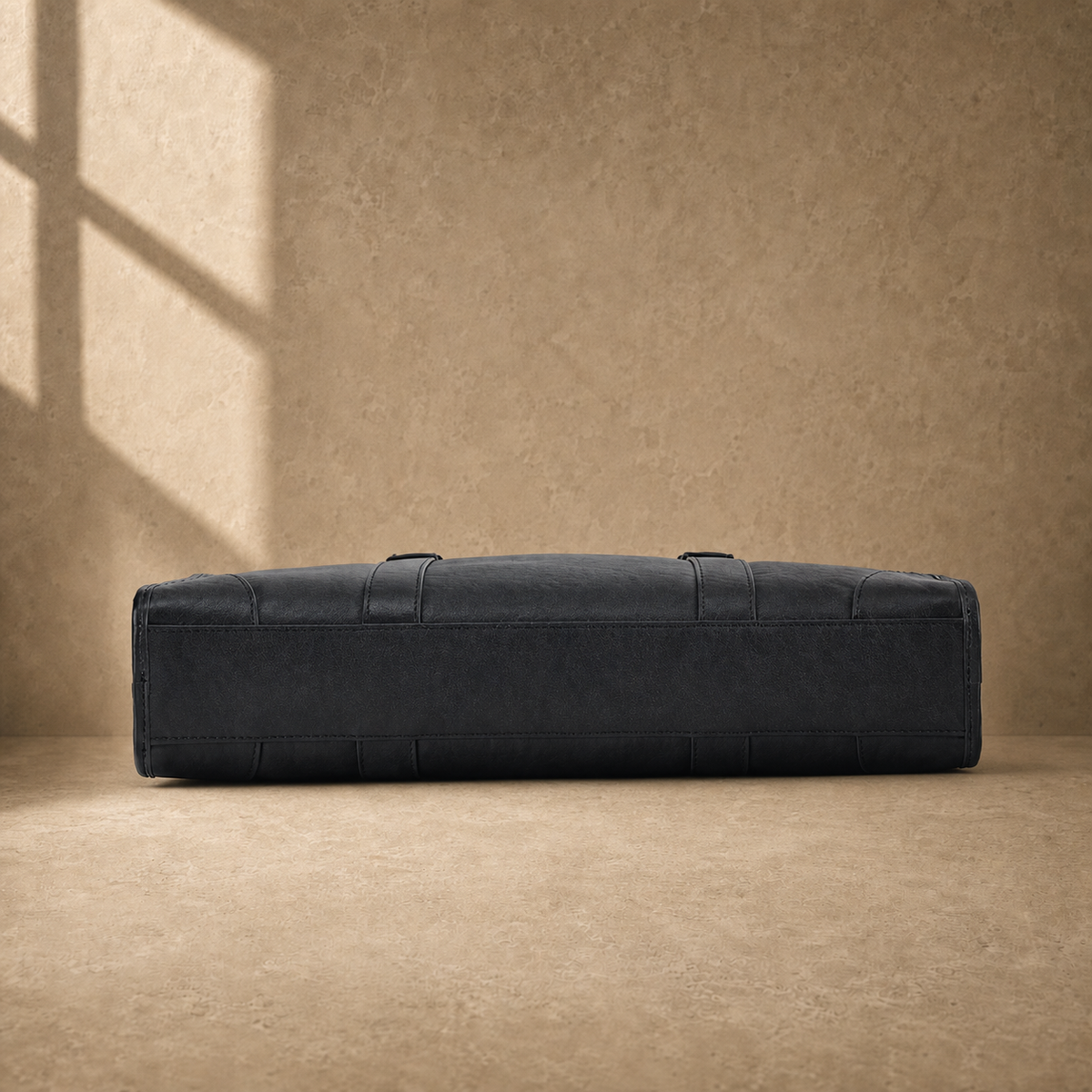 Black vegetable-tanned leather briefcase, reinforced base view