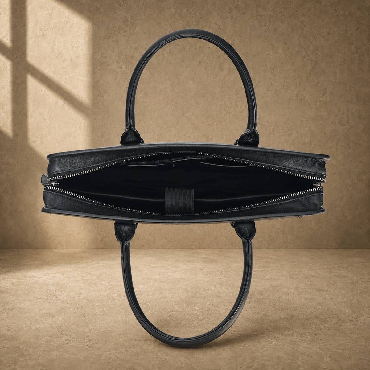 Black vegetable-tanned leather briefcase, open empty interior