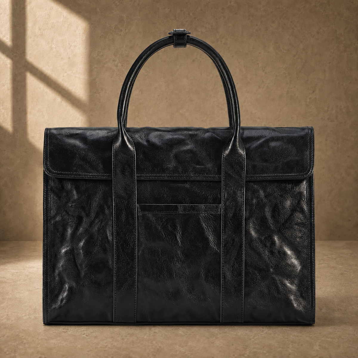 Black wrinkled leather briefcase, straight front view