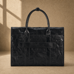 Black wrinkled leather briefcase, rear luggage pass-through view