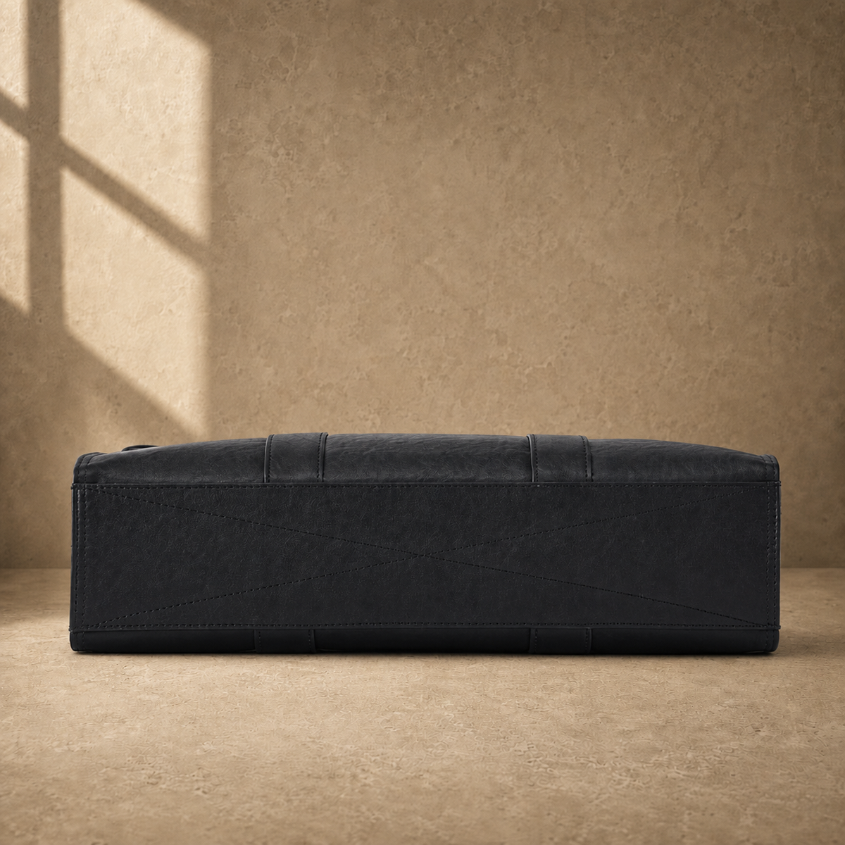 Black wrinkled leather briefcase, reinforced base view