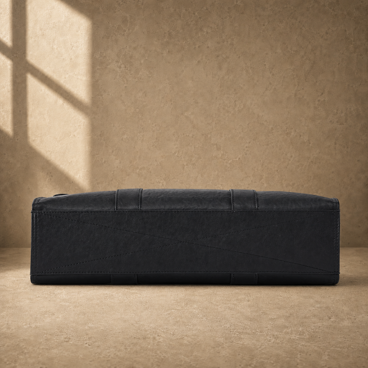Black wrinkled leather briefcase, reinforced base view