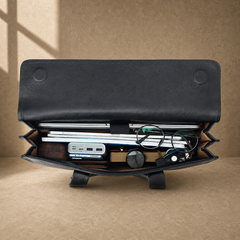 Black wrinkled leather briefcase, packed interior capacity view