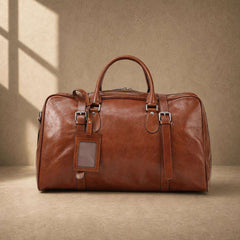 Chestnut cowhide executive weekender with luggage tag, front view