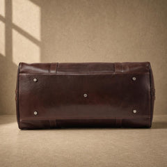 Coffee cowhide executive travel tote with protective metal feet