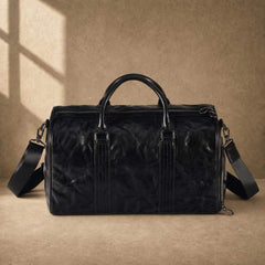 Black cowhide leather weekender duffel bag shown from the front